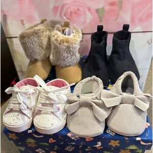 Set of 4 brand new baby shoes.